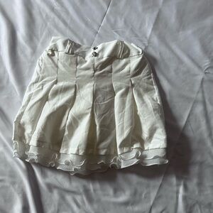 White Pleated Skirt with Ruffle Hem